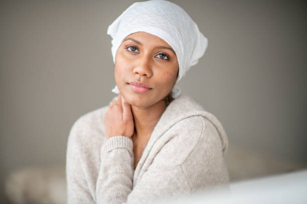 istock Beautiful cancer patient at home 1288307583