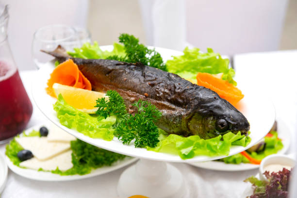 istock cooked fish , baked trout, on the Banquet table 1288308376