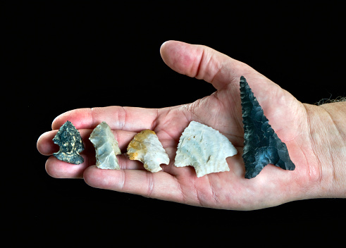 A handfull of real Texas arrowheads made around 7000 years ago.