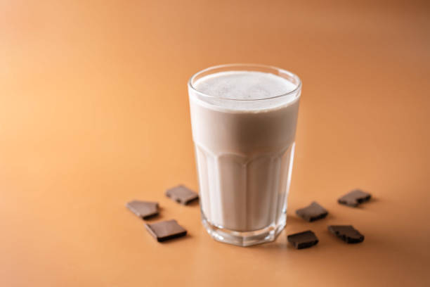 istock Chocolate cocktail in a glass on a brown background 1288310698