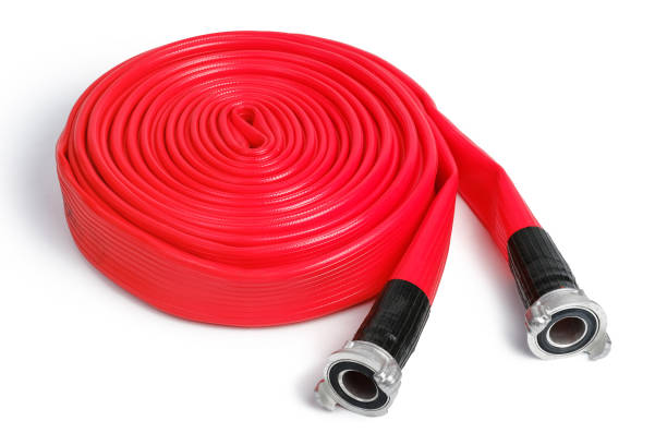 istock Rolled red fire hose isolated on the white background. 1288312848