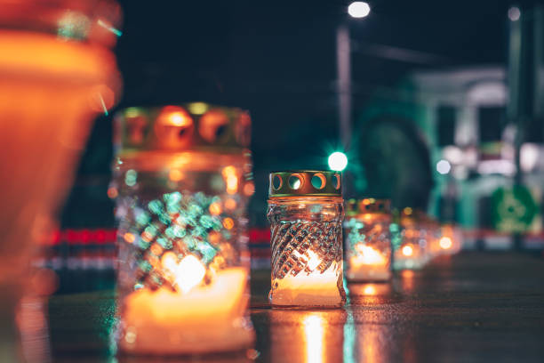 istock Close-Up Of Illuminated Candles On Table At Night 1288317790