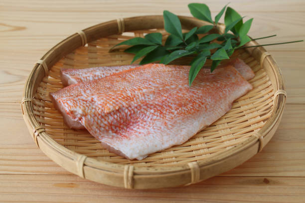 fillet of raw fish on the bamboo colander - rockfish imagens e fotografias de stock