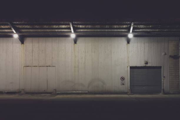 istock Shuttered entrance to an industrial warehouse 1288320127