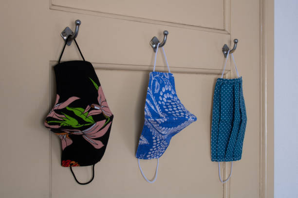 istock Face masks hanging on door hooks 1288324146
