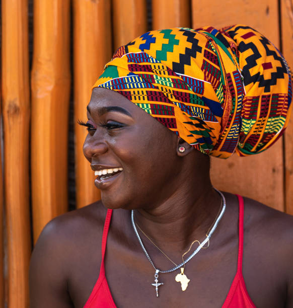 Happy African woman in the small village Happy African woman in the small village of Keta located in Ghana, dressed in African headdress ghana photos stock pictures, royalty-free photos & images