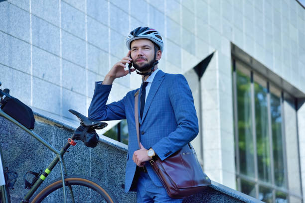 istock Bearded businessman talking by mobile phone 1288328140