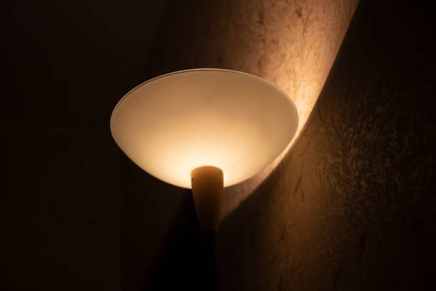 istock Lamp in the room. The night light shines on the wall. 1288330096