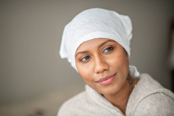 istock Beautiful cancer patient at home 1288332210
