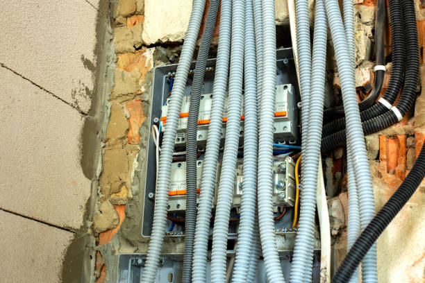 istock Electrical cables laid in protective corrugation installed on the ceiling and wall in a room under construction works. 1288333916