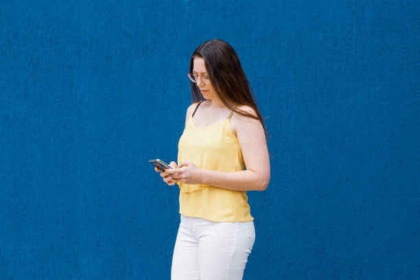 istock Adult woman using cell phone. 1288334524