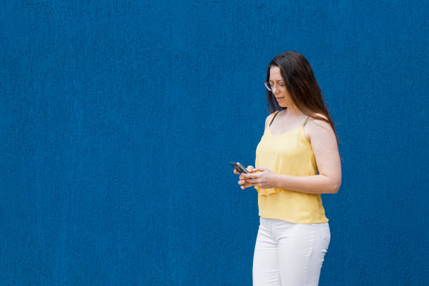 istock Portrait of young man using mobile device to send message 1288334542