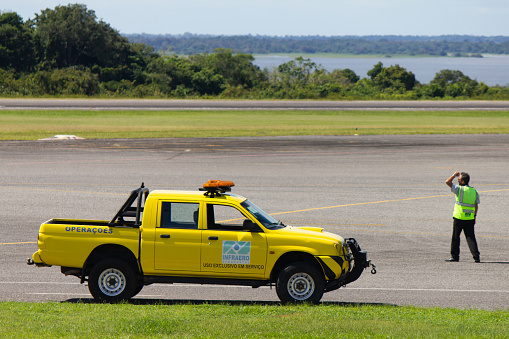 Santarem/Para/Brazil - May 11, 2019: Infraero (Brazilian federal public company for airport administration) official making visual check of infrastructure conditions of Santarem airport.