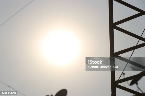 Electric Pole With Sun And Sky Background Showing Energy Concept Stock Photo - Download Image Now