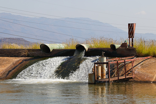 A water management reservoir dam with level controlled inlet pipes, Burgersfort, South Africa
