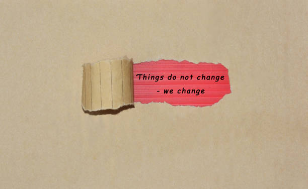 istock Motivational quote written on brown torn paper 1288349820