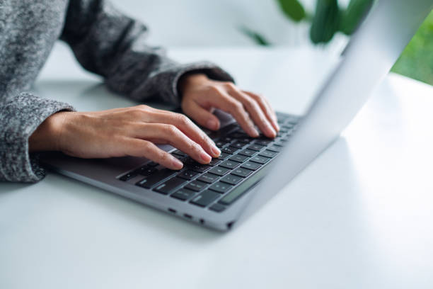 istock a woman working and typing on laptop computer keyboard on the table 1288352176