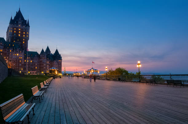 Chateau Frontenac and Dufferin terrace at dusk Chateau Frontenac and Dufferin terrace at dusk, Quebec city, Quebec, Canada chateau frontenac hotel stock pictures, royalty-free photos & images