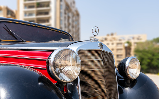 Cairo, Egypt- July 29 2020: 1953 Black and red Mercedes antique car, displayed in front of Baron Empain Palace, located in Heliopolis District