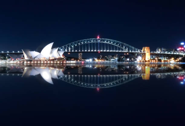 vibrant colours of Sydney Harbour Bridge at night NSW Australia vibrant colours of Sydney Harbour Bridge at night NSW Australia opera stock pictures, royalty-free photos & images