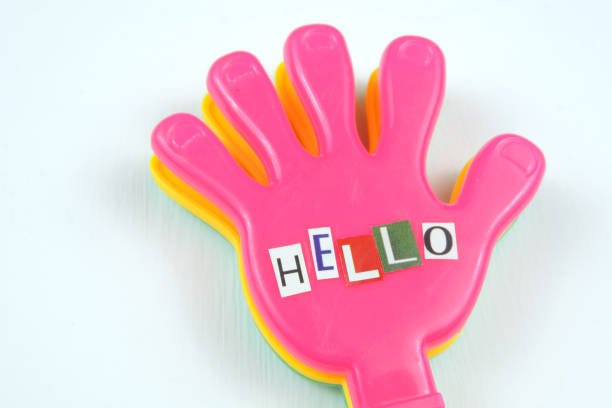cut letters and word Hello on a colorful decorative palm
