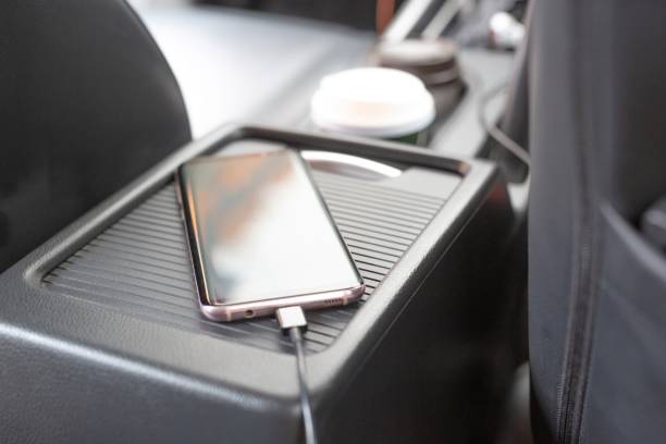 Plug to charge mobile phone in the car. stock photo