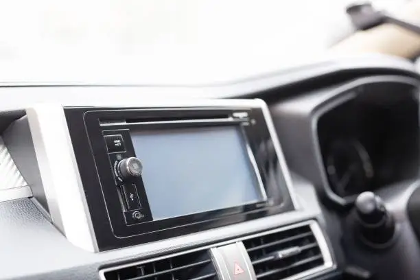 In-car control buttons and a music player.