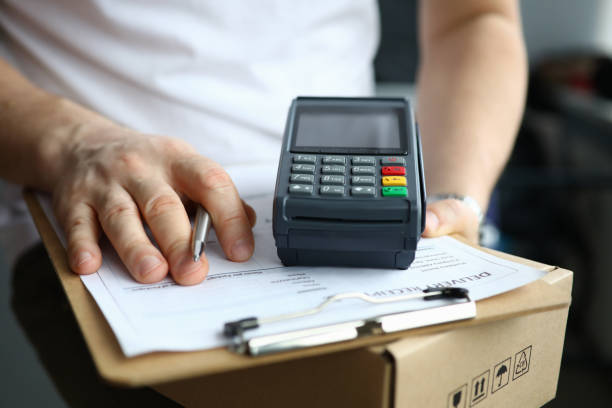 istock Person holding silver pen 1288369199