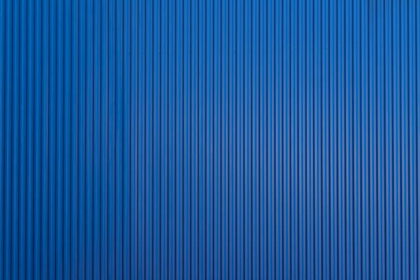 blue corrugate metal sheet background and texture. blue cargo panel wall.