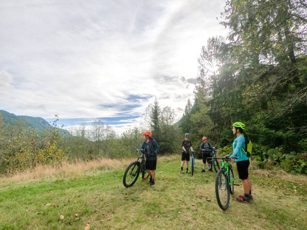istock Multi-Ethnic Mountain Biking Family Arriving at Forest Viewpoint 1288372815