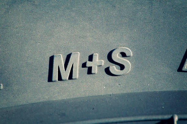 Winter tire sign M+S, selective focus, narrow depth of field