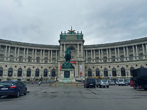 Vienna Austria - 08/17/2015 : Hofburg Neue Burg section with statue of Archduke Charles at cloudy day
