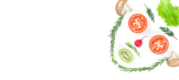istock Funny face from different vegetables tomatoes, cucumber, radish, dill and rosemary isolated on white background. Healthy eating and vegan food concept. Kitchen 1288379629