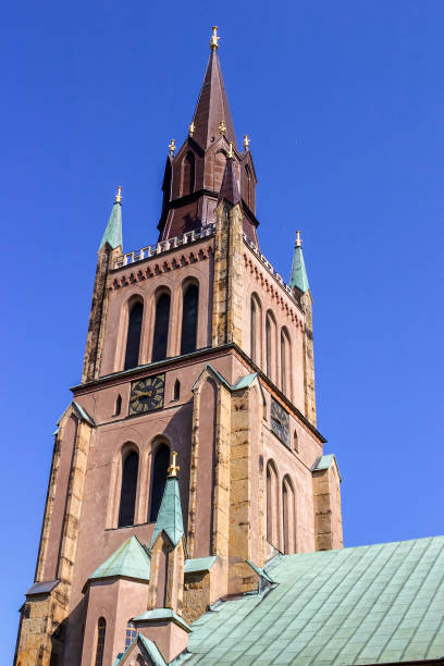 istock Old church tower against a blue sky 1288379719