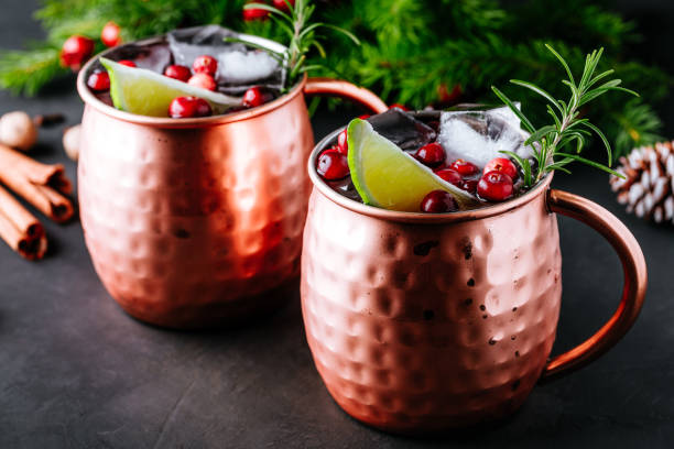 istock Moscow Mule cocktail with cranberries in copper mugs for Christmas 1288380106