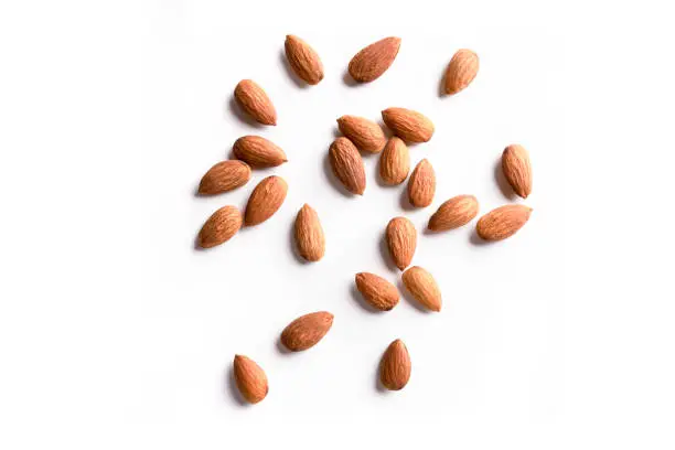 Roasted peeled almond nuts texture ,top view. Almond nuts background. Best healthy food almond concept