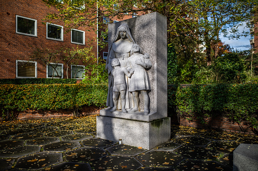 In March 1945 the catholic French School - Jeanne d'Arc  School - in Frederiksberg was bombed by accident by British airplanes. 86 children and 18 adults were killed.  \nThe monument commemorating the disaster was designed by the Danish architect Ole Hagen.\nFredeiksberg is an autonomous municipality i Copenhagen, Denmark