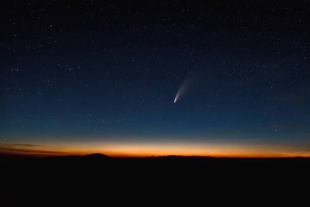 istock stars comet neowise night mountains sky 1288383247