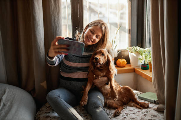 istock Pregnant Woman Making Selfie With Her Dog 1288383624
