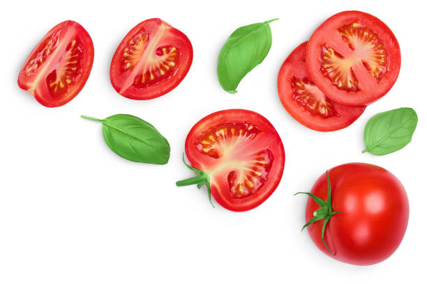 istock Tomato slices with basil leaf isolated on white background. Clipping path. Top view with copy space for your text. Flat lay 1288384948