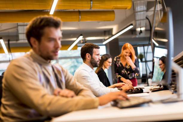 istock Young professional businessman uses a computer for work in the office 1288385533