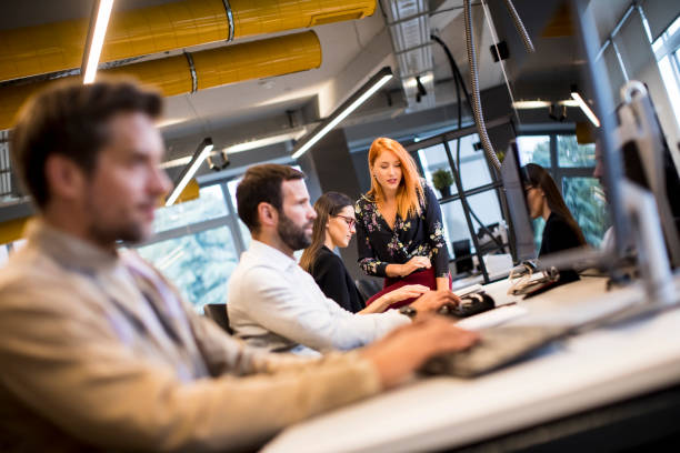 istock Young professional businessman uses a computer for work in the office 1288385542