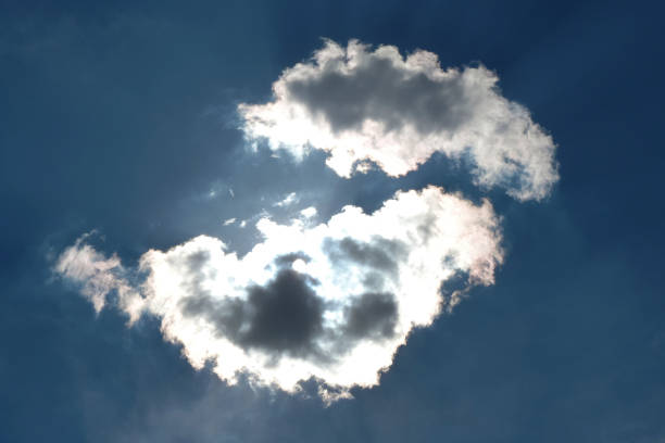 istock dark blue sky and white clouds illuminated by the sun 1288386349