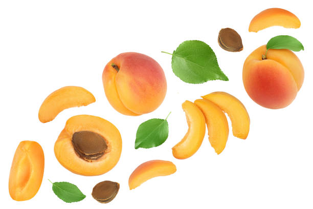 istock apricot fruit with half and slices isolated on white background. Clipping path. Top view. Flat lay 1288386465