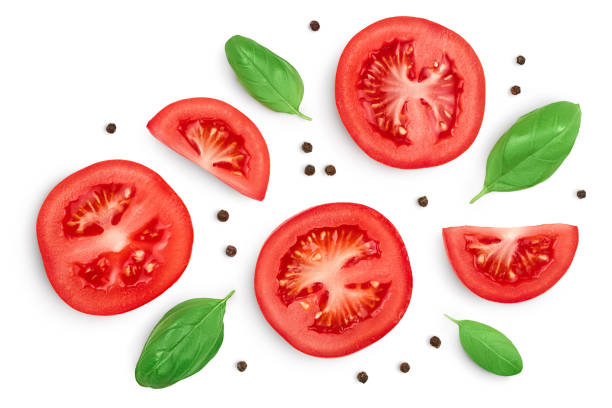 istock Tomato slices with basil and peppercorns isolated on white background. Clipping path and full depth of field. Top view. Flat lay 1288389359