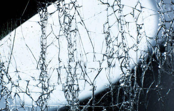 istock Broken glass texture. Close up photo. 1288392359