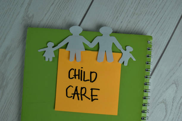 istock Child Care write on sticky notes isolated on office desk. 1288393001