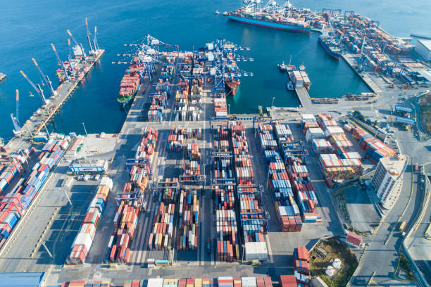 istock Container ship loading and unloading in deep sea port, Aerial view business commercial trading logistic import and export freight transportation, Container loading cargo freight ship maritime 1288393037