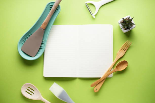istock Kitchen utensils on a green background with space for text. Flat lay. 1288394347