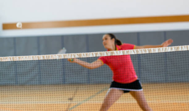 istock Woman Playing Badminton 1288395573